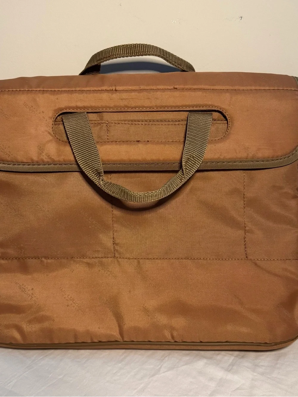 Us Luggage Tan tote laptop bag featuring a luggage sleeve and inner pockets